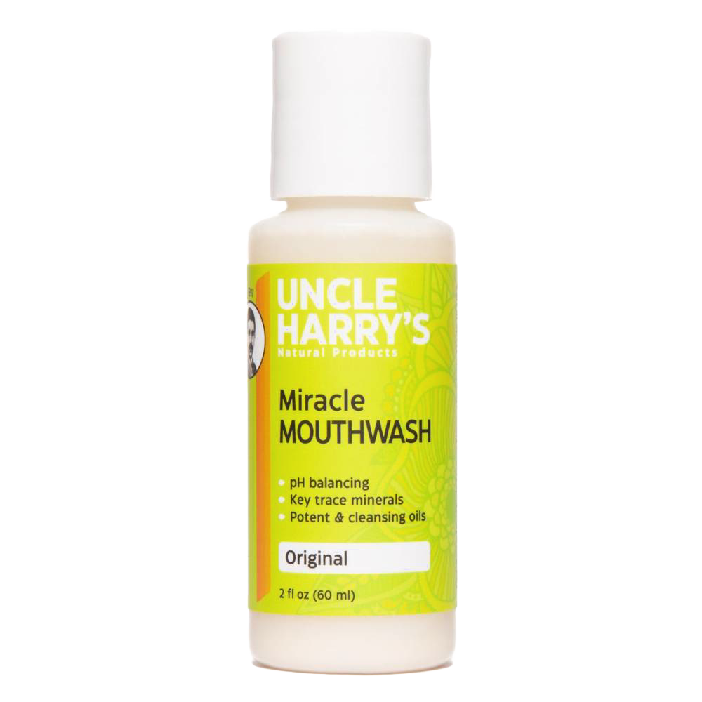 Small white plastic bottle of natural mouthwash with a bright yellow and green label featuring pH balancing and mineral benefits, suitable for Health & Wellness and Grooming collections.