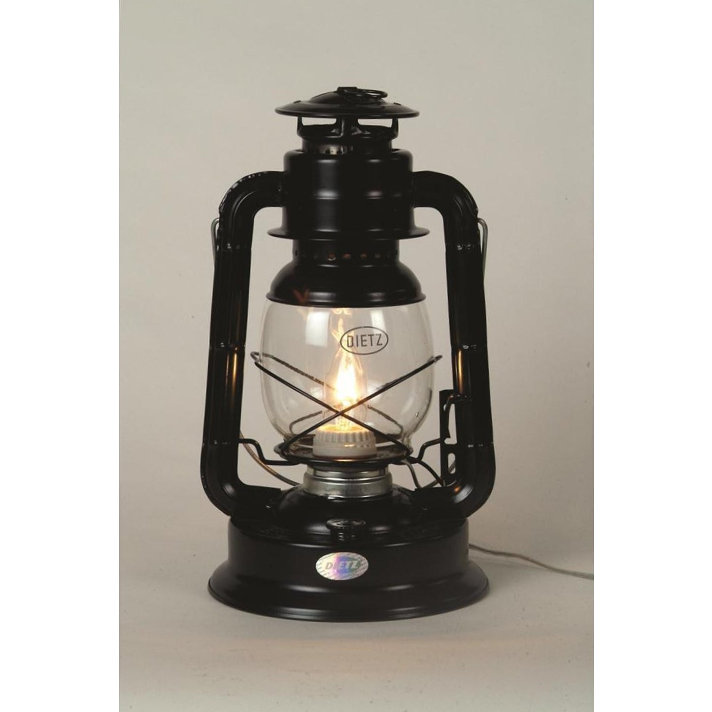 Black metal lantern converted to electric light with clear glass globe and visible bulb, handcrafted for use in Lamps & Lighting, Emergency Supplies, and Electric Conversion collections.