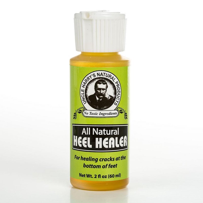 Small 2 oz amber bottle with white cap labeled "All Natural Heel Healer" for soothing cracked feet, highlighting natural ingredients and USA made quality, featured in Health & Wellness collections.