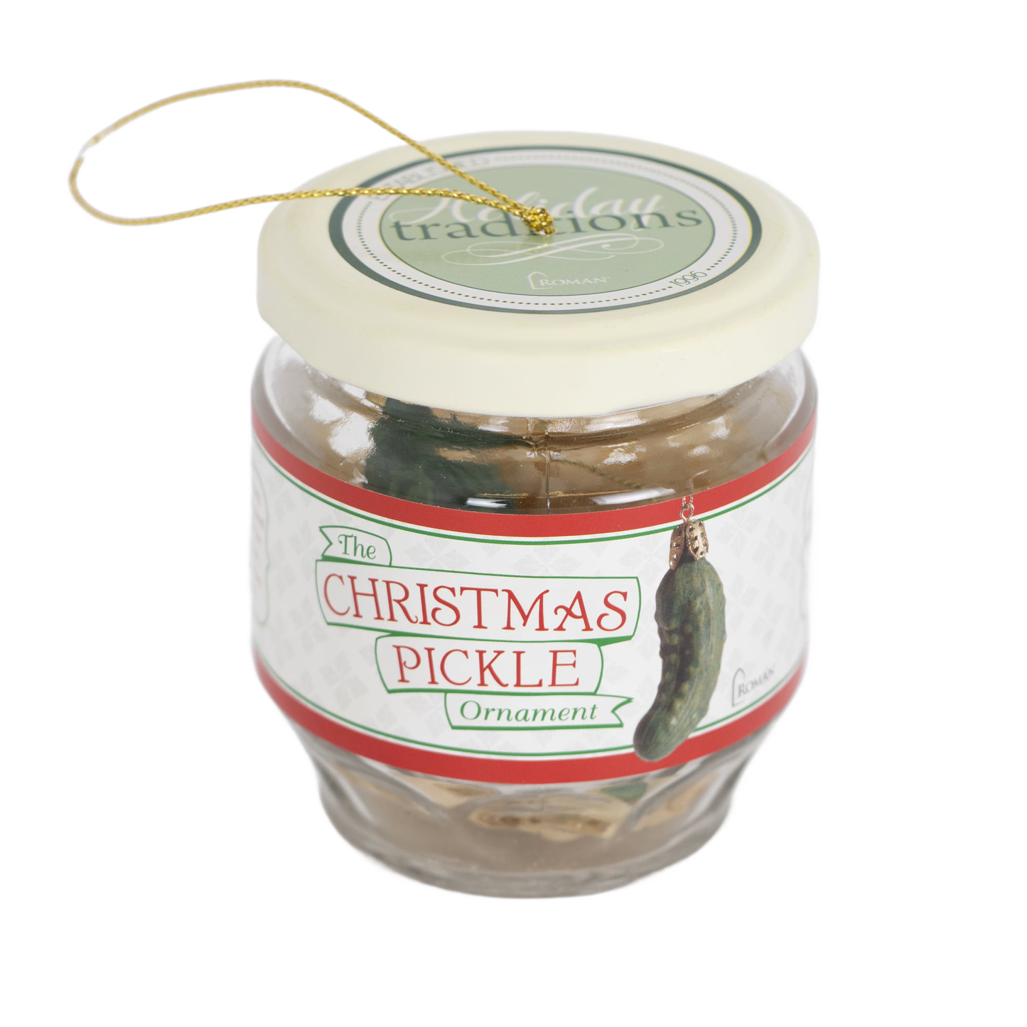 Clear glass jar with a cream lid containing a green pickle ornament with a gold hanging string, a handcrafted holiday decor item from Home & Decor and Best Sellers collections.