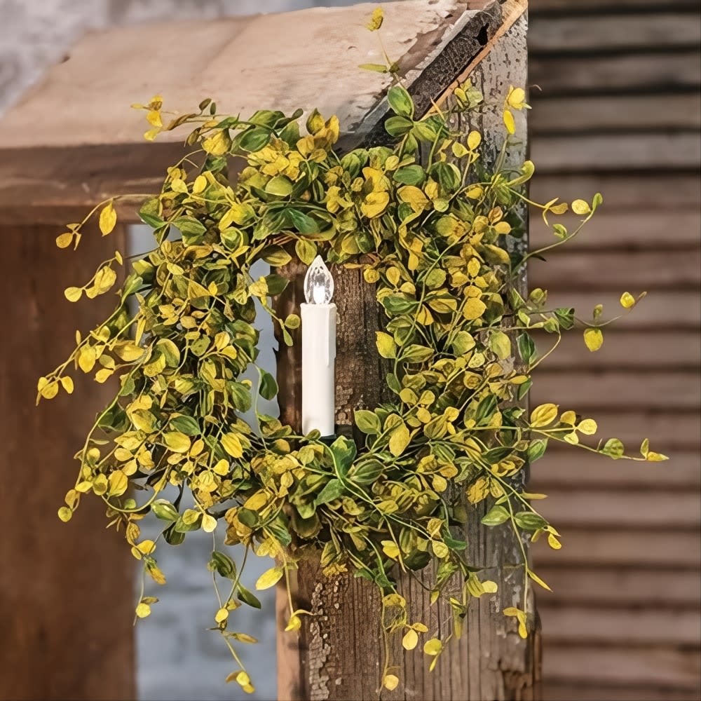 Handcrafted wreath with yellow-green leaves surrounding a warm white LED taper candle clipped to rustic wood, perfect for Home & Decor, Holiday Decor, Best Sellers, and Promo Eligible collections.