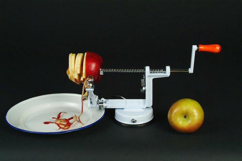 Handcrafted Apple Express Suction Cup Peeler in action peeling, coring, and slicing a red apple over a white plate, featured in Farm, Garden & Tool, Kitchen & Food, and Apple Harvest Supplies collections.