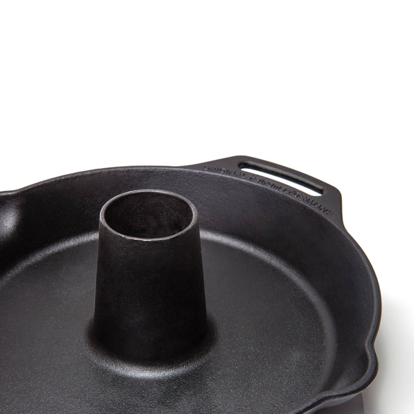 Heavy-duty cast iron poultry roaster with a central cone for even cooking, featuring a sturdy handle, perfect for Kitchen & Food, Cookware, Cast Iron, Pots and Pans, and Best Sellers collections.