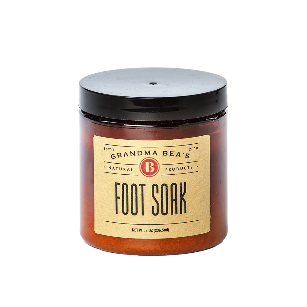 Amber glass jar of handcrafted foot soak with black lid, made in USA, featured in Health & Wellness, Health Remedies, Grooming and Personal Hygiene, and Best Sellers collections.