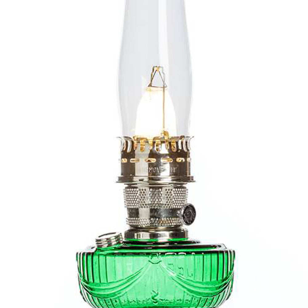Handcrafted oil lamp featuring a vibrant emerald glass font with a sweeping Lincoln drape pattern, brass burner and knob, tall clear chimney, ideal for Lamps & Lighting and Table Lamps collections.