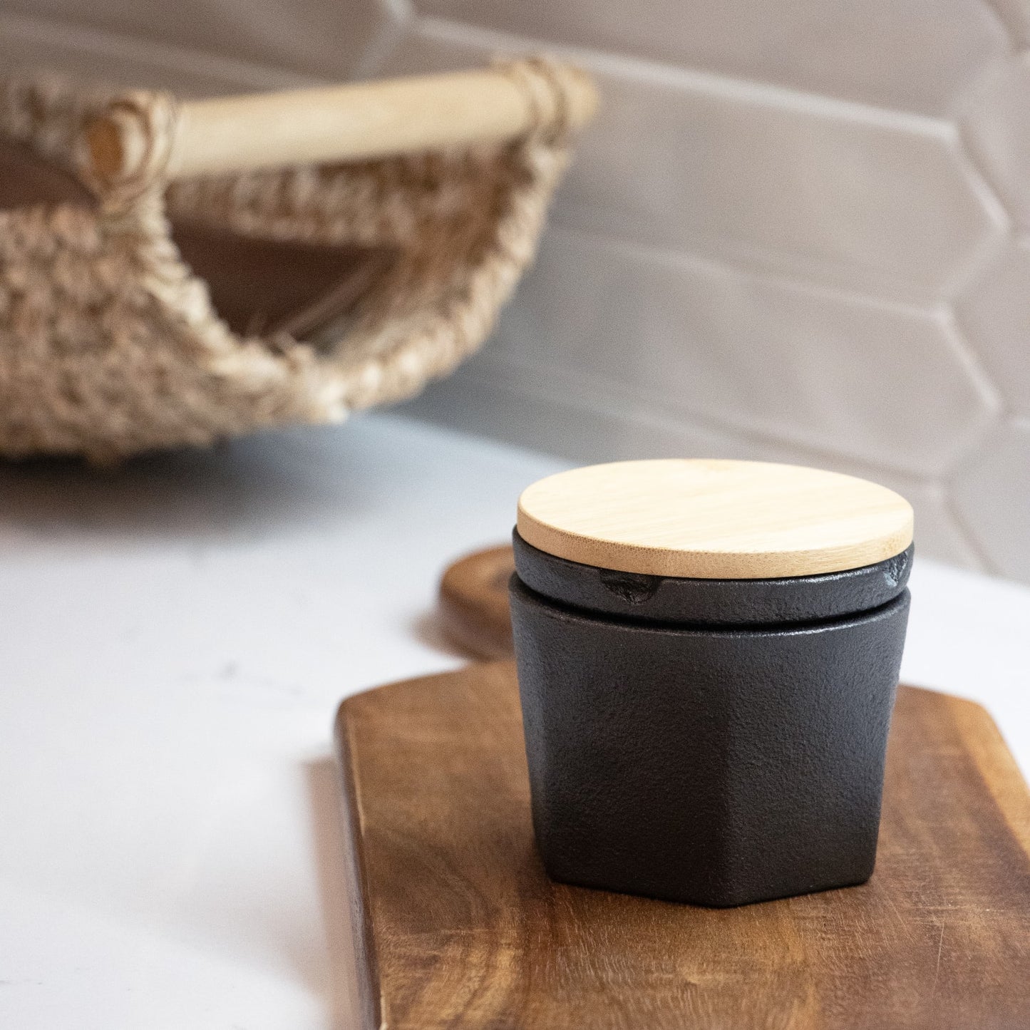 Compact cast iron spice grinder with bamboo lid and silicone gasket, designed for customizable grinding of herbs and spices, featured in Kitchen & Food and Best Sellers collections.