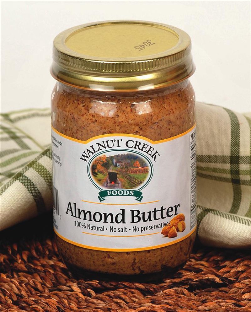 Jar of all-natural almond butter with no salt or preservatives, displayed with rustic fabric and almonds, perfect for Kitchen & Food, Food, and Best Sellers collections.