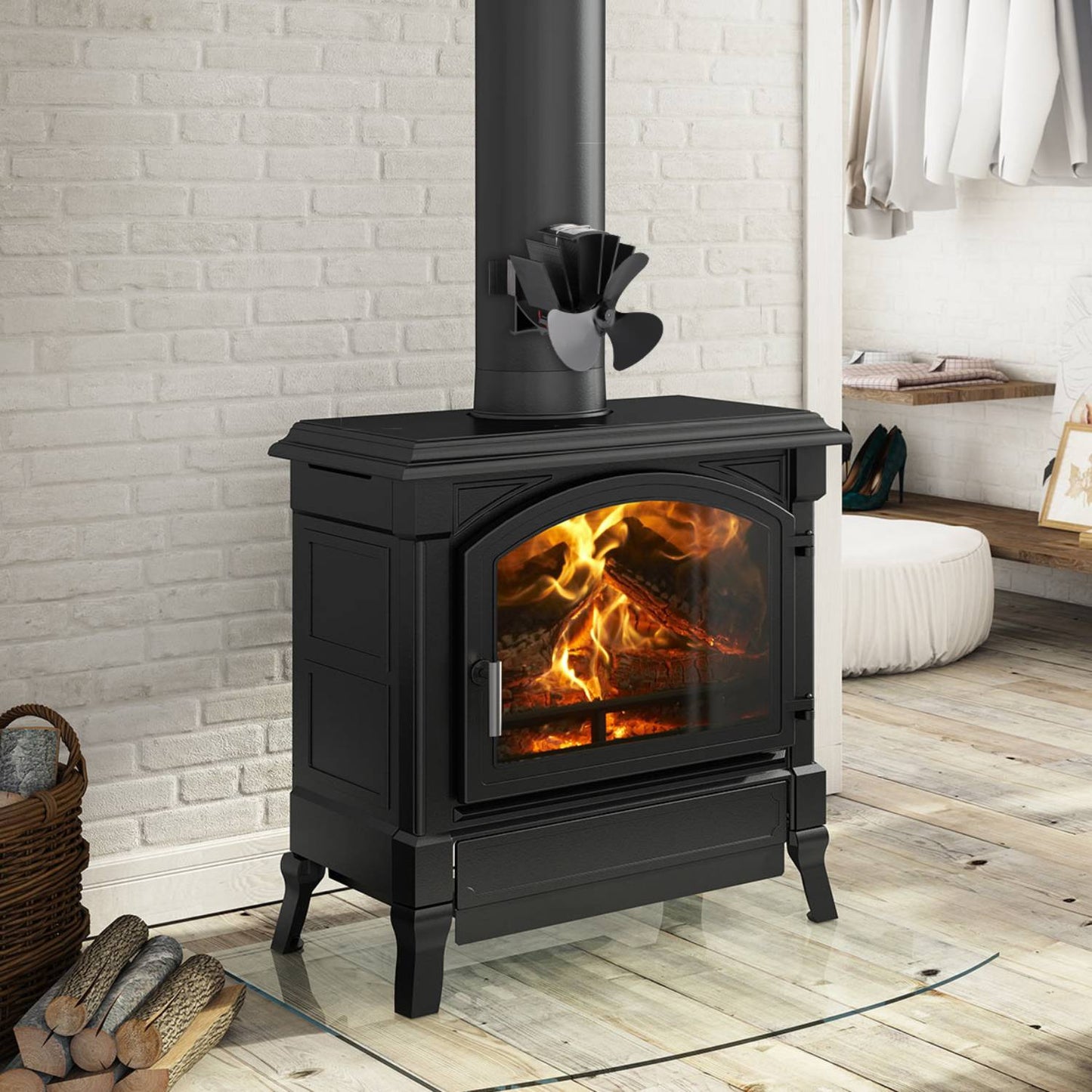 Black heat-powered magnetic fan with three blades mounted on a wood stove flue pipe, designed to circulate warm air efficiently; featured in Stoves, Hearth Accessories, Best Sellers, Promo Eligible, and All Stoves & Appliances collections.