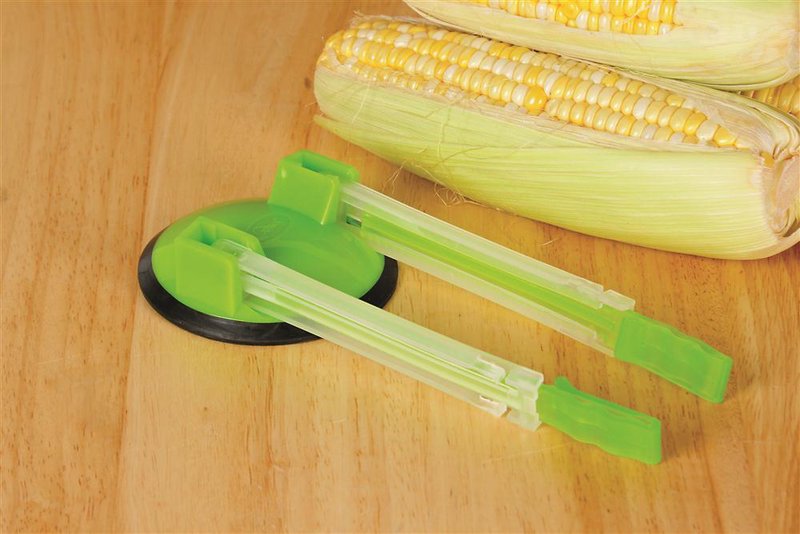 Green plastic bag holder with suction base securing a zipper bag open for hands-free filling, designed to simplify food preparation in Kitchen & Food, Kitchen Gadgets, Cooking and Baking Helpers, Best Sellers, and Promo Eligible collections.