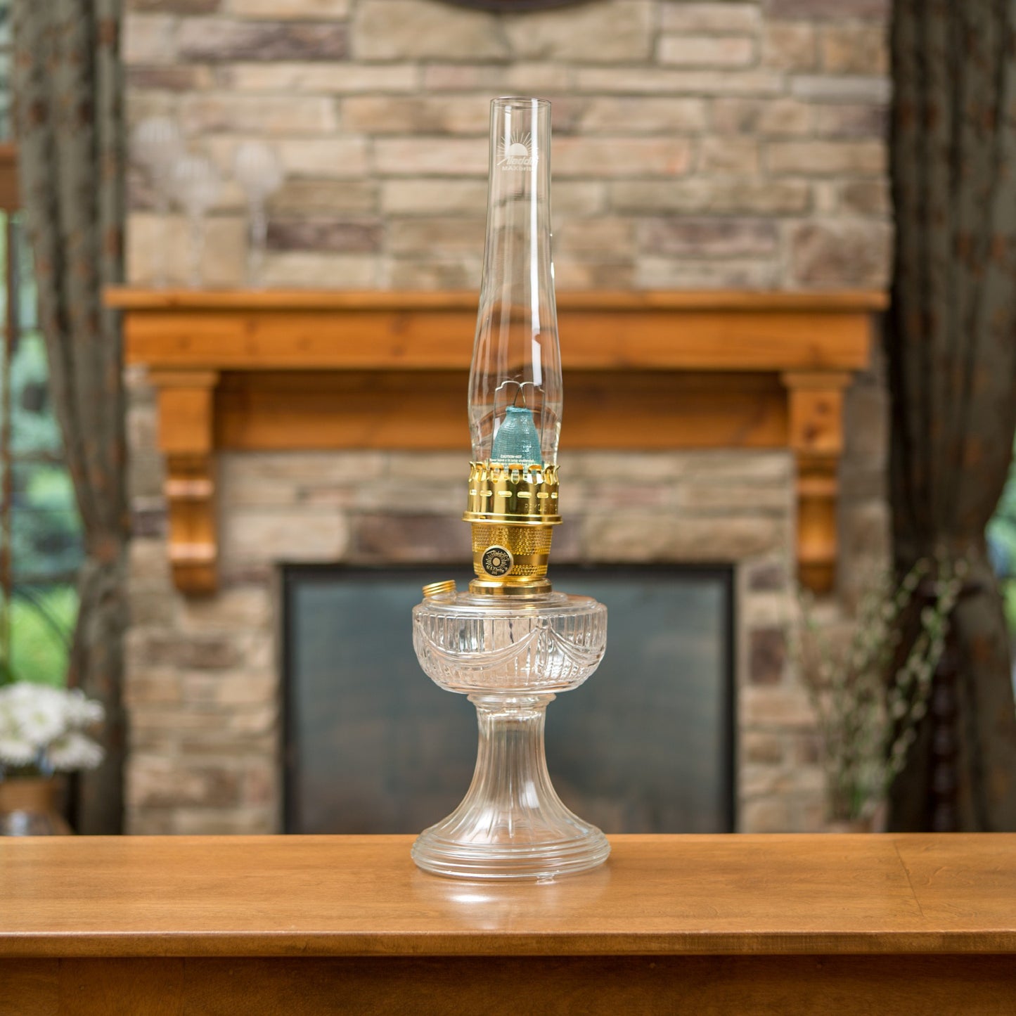 Clear antique-style oil lamp with USA-made glass base and brass burner, designed for Lamps & Lighting, Oil Lamps, Table Lamps, Best Sellers, and Promo Eligible collections.