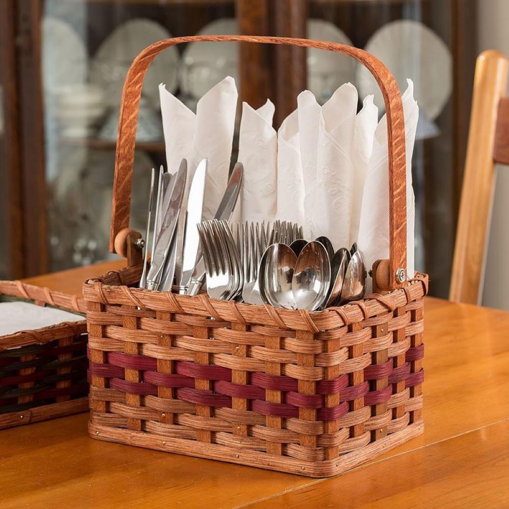 Handwoven wooden silverware basket with handle, divided into four sections holding knives, forks, spoons, and napkins, showcasing Amish-made craftsmanship for Kitchen & Food and Dinnerware collections.