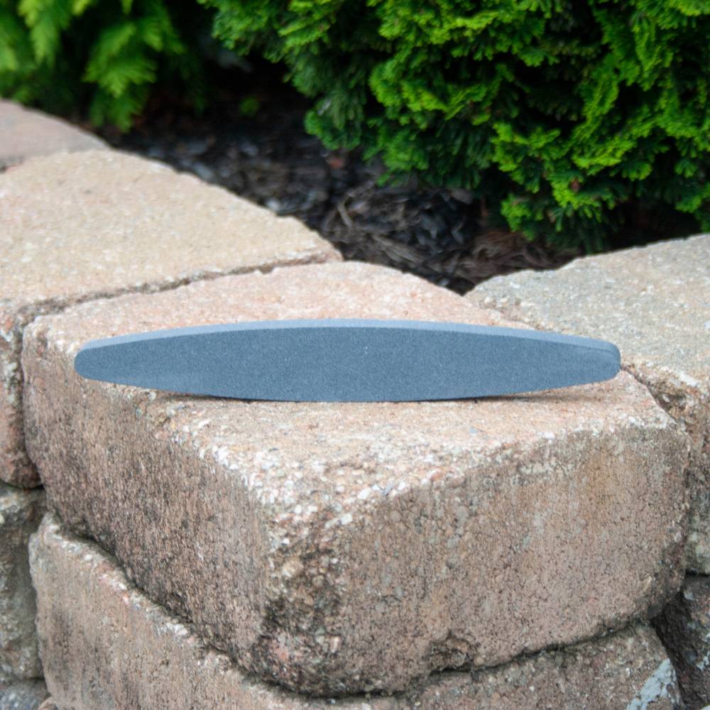 Elliptical-shaped crystolon whetstone with 150 grit coarse surface for finishing scythe blades and sharpening garden tools, featured in Farm, Garden & Tool, Lawncare, and Best Sellers collections.