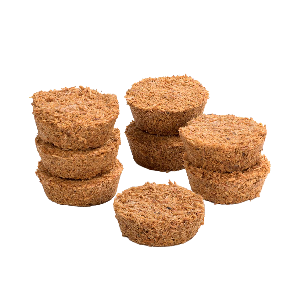 Eight handcrafted Fatwood Firedrops made from natural sawdust and paraffin, arranged in small stacked piles, perfect for camping, emergency supplies, and outdoor fire-starting.