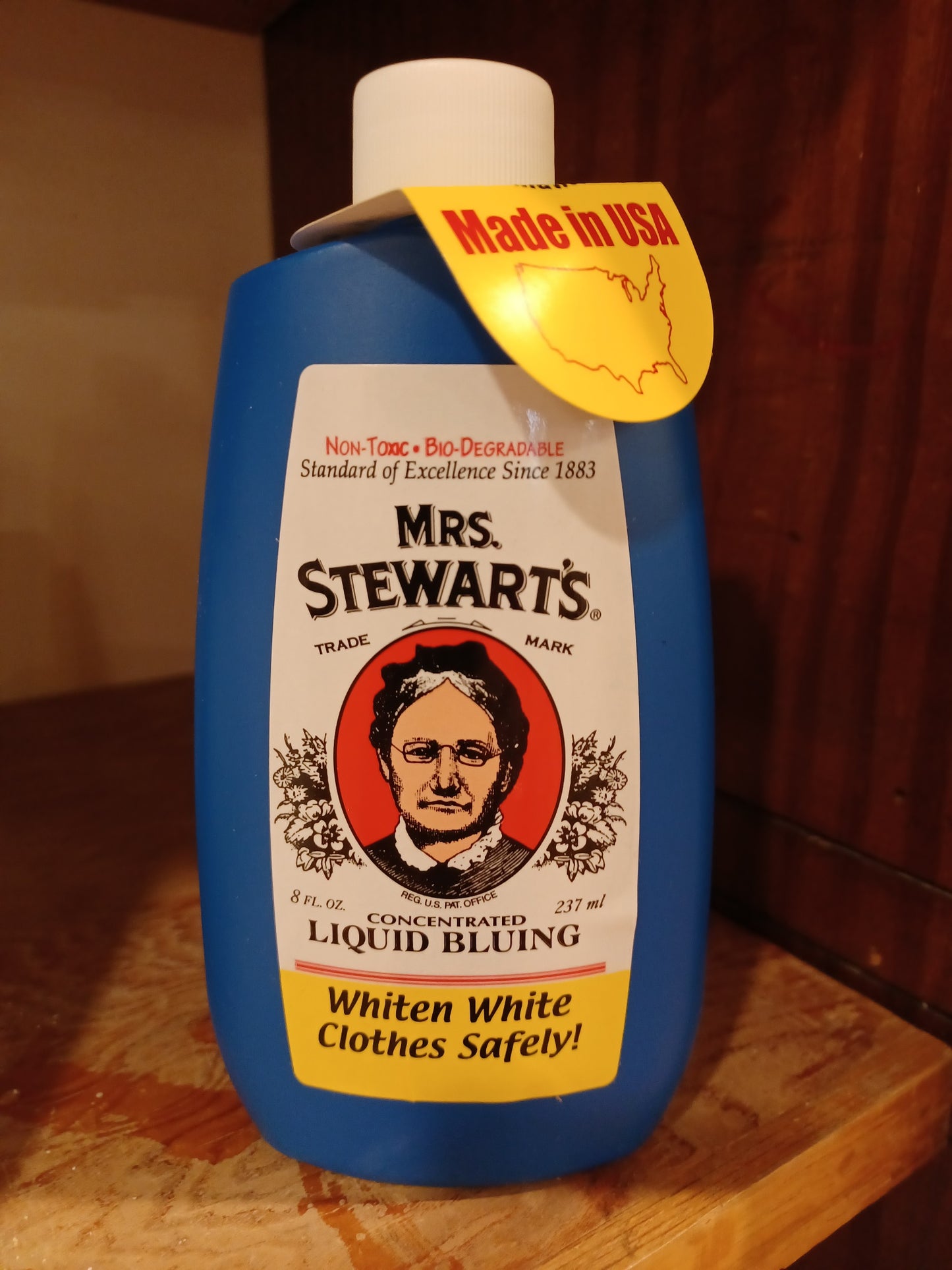 Blue 8-ounce bottle of Mrs. Stewart's concentrated liquid bluing with vintage-style label, non-toxic and biodegradable, made in USA, ideal for Laundry Supplies and Home & Decor collections.