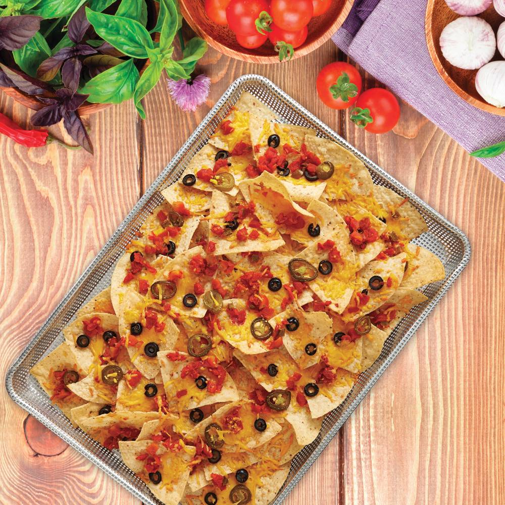 Handcrafted half size perforated non-stick crisp pan holding freshly baked nachos topped with melted cheese, diced tomatoes, sliced jalapeños, and black olives, featured in Kitchen & Food, Cookware, Baking Supplies, Best Sellers, and Promo Eligible collections.