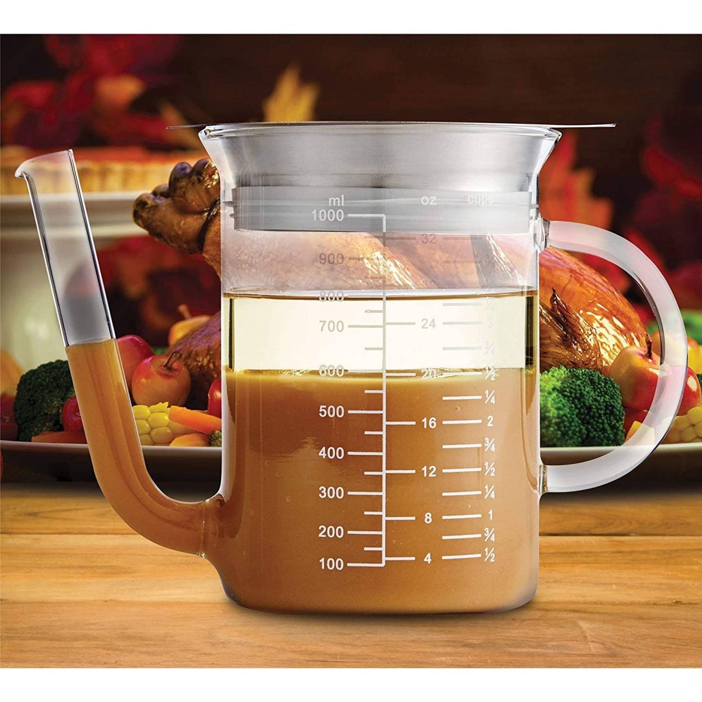 Clear borosilicate glass fat separator with wide spout and comfortable handle, featuring measurement markings, suitable for Kitchen & Food, Food Prep, Measuring, and Best Sellers collections.