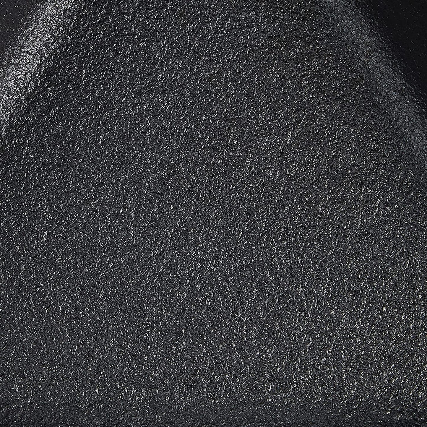 Close-up of the seasoned black cast iron surface with textured finish, showcasing durable craftsmanship ideal for Kitchen & Food, Cookware, Cast Iron, USA Made, and Best Sellers collections.