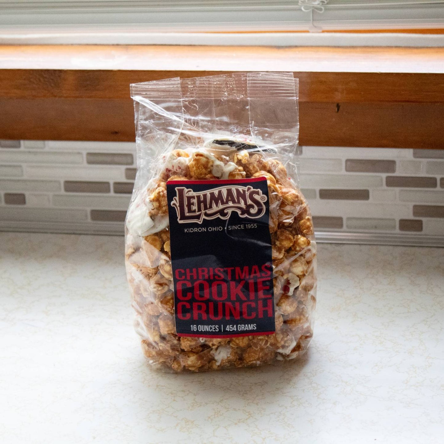 Clear bag of handcrafted caramel popcorn blended with festive cookies and holiday flavors, perfect for Kitchen & Food, Food, Snacks and Sweets, Popcorn, Best Sellers, and Promo Eligible collections.