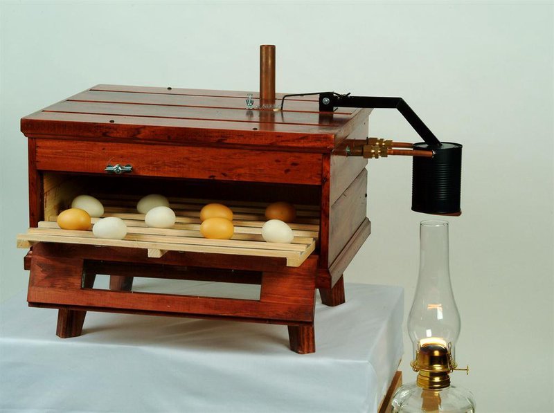 Handcrafted Amish-made wooden kerosene-powered egg incubator with eggs inside, designed for Farm, Garden & Tool, Animal Care, Chicken Accessories, USA Made, and Best Sellers collections.