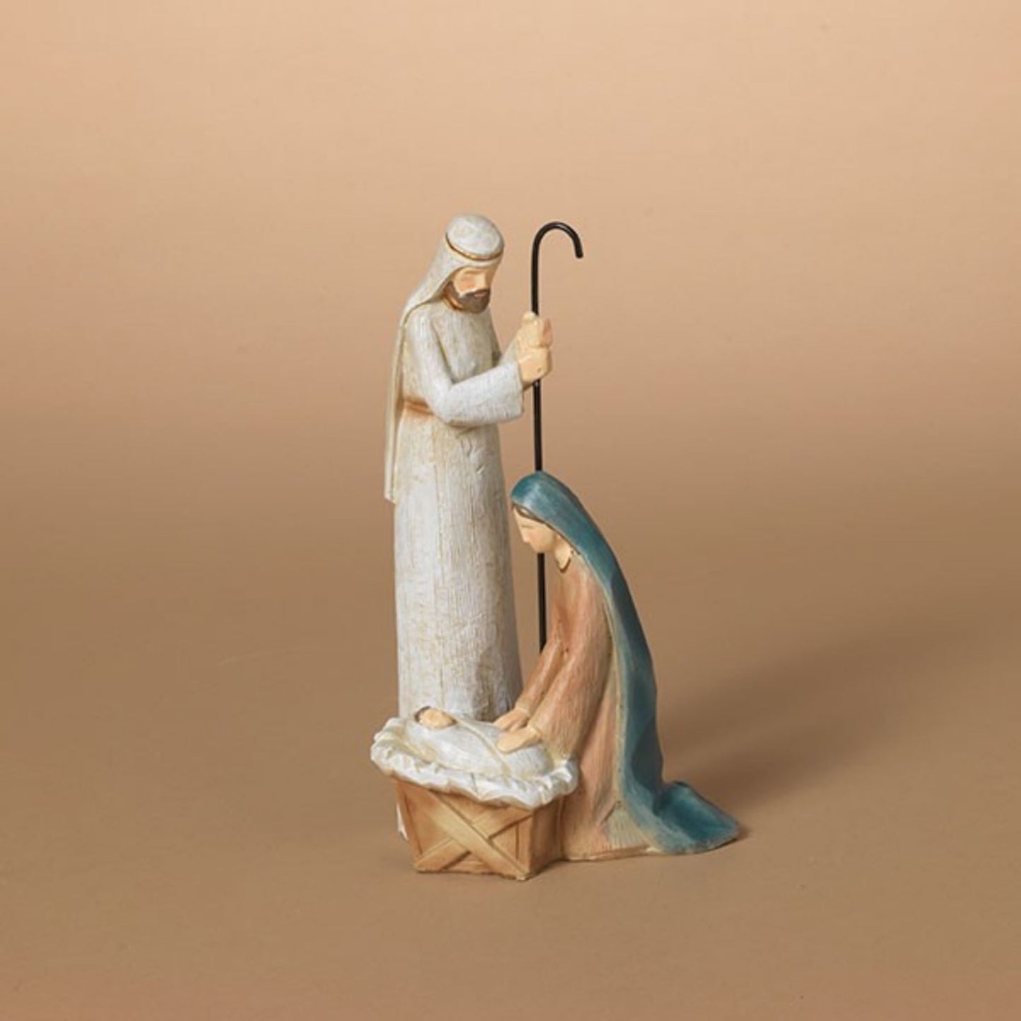 Handcrafted resin nativity figurine depicting the Holy Family with Joseph standing and Mary kneeling beside a manger, ideal for Home & Decor, Holiday Decor, Best Sellers, and Promo Eligible collections.