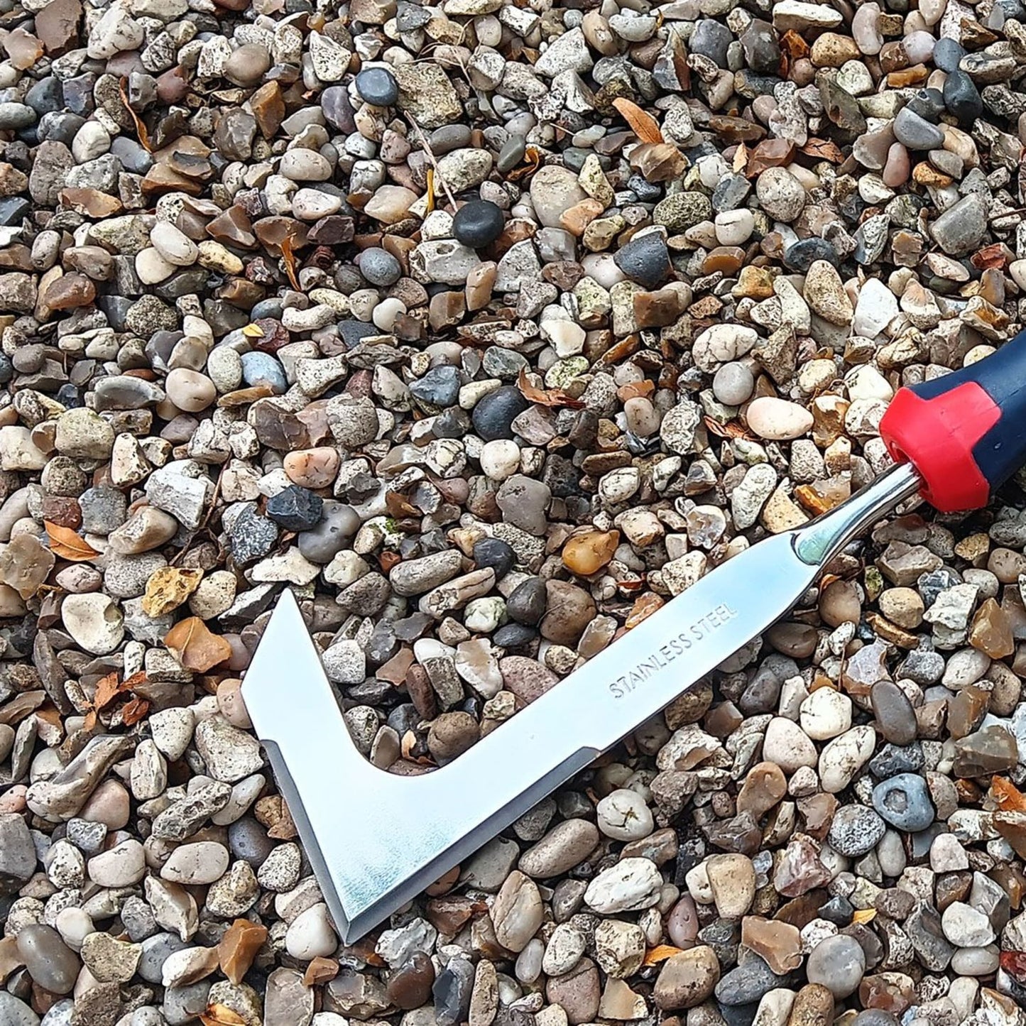 Slim stainless steel patio knife with bi-material contoured handle and tanged design for knuckle clearance, ideal for clearing moss from pavers, featured in Farm, Garden & Tool, Garden Accessories, Lawncare, and Best Sellers collections.