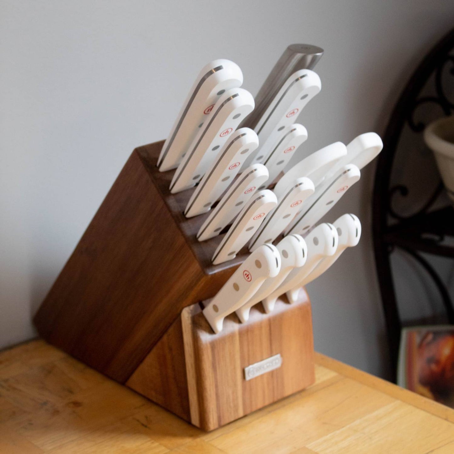 Wooden knife block with an array of 16 kitchen knives featuring white ergonomic handles and stainless steel blades, designed for versatile food prep in Kitchen & Food and Knives & Axes collections.