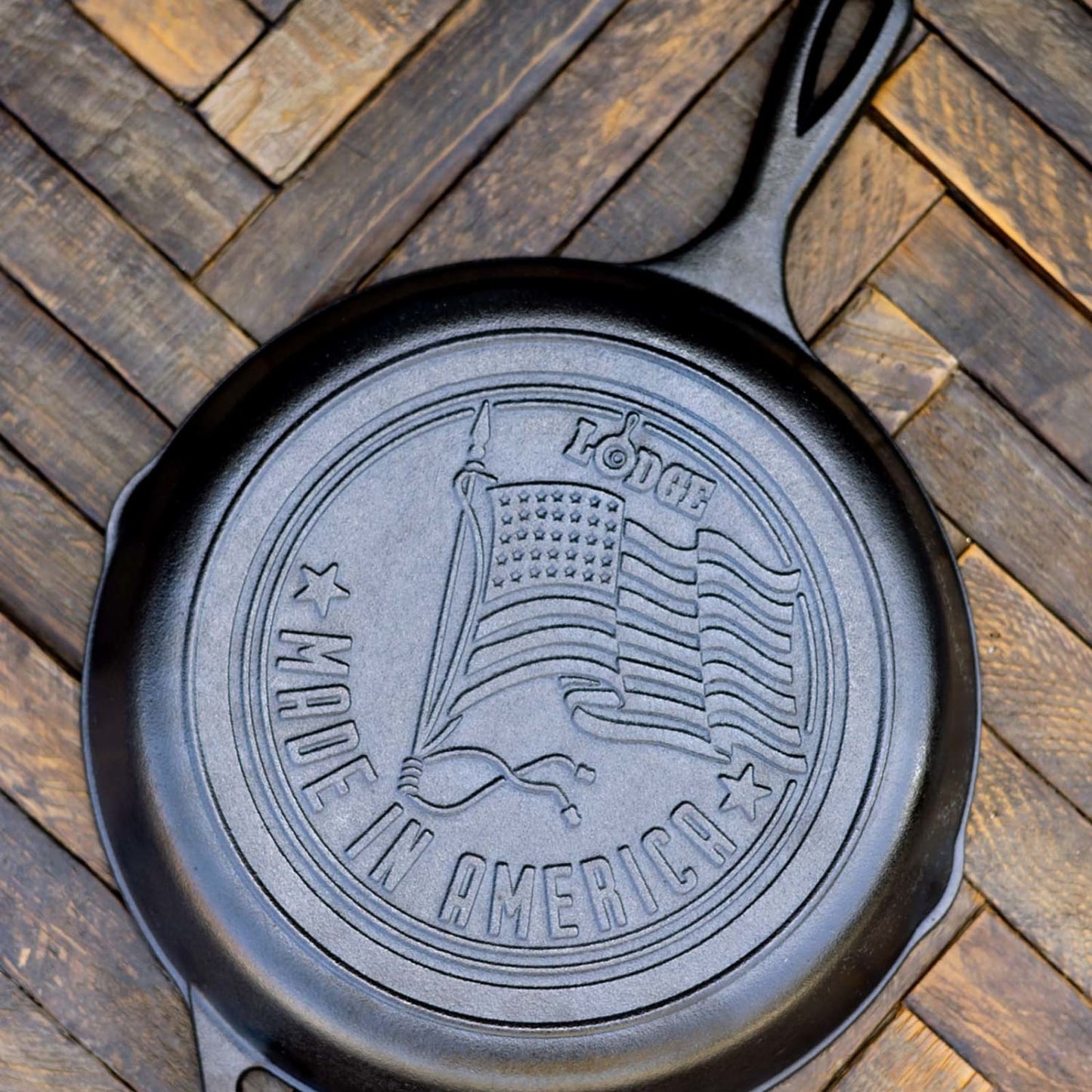 Handcrafted cast iron skillet with embossed American flag and "Made in America" text, featuring durable construction for Kitchen & Food, Cookware, Cast Iron, USA Made, and Best Sellers collections.