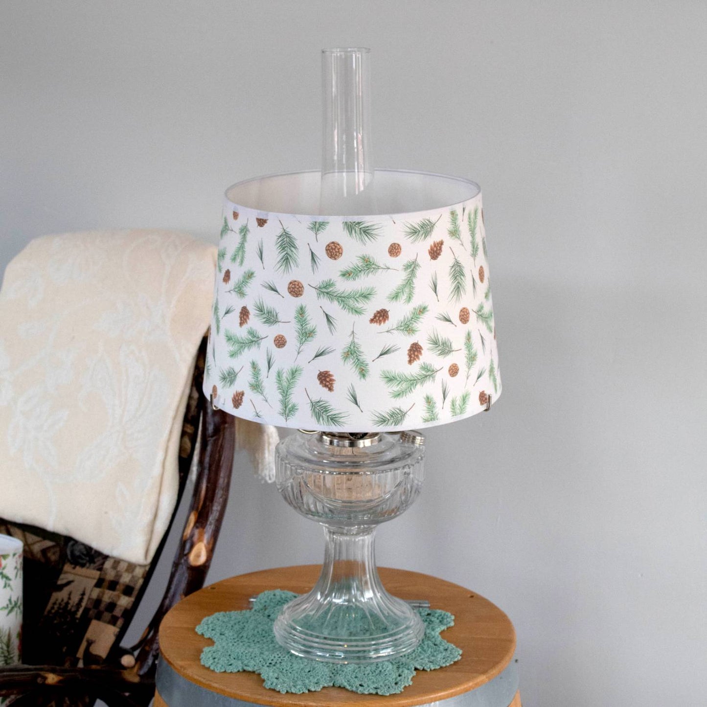 Handcrafted parchment lamp shade featuring festive pine bough and pinecone patterns, designed to softly diffuse light; ideal for Lamps & Lighting, Parts and Accessories, Lamp Shades, Best Sellers, and Promo Eligible collections.