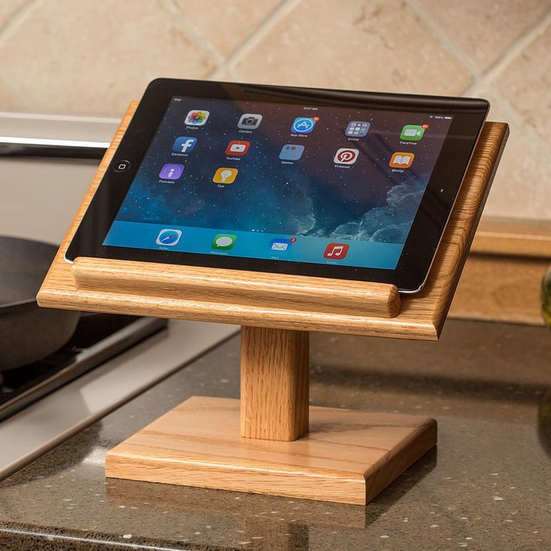 Handcrafted oak stand with a clear, smooth finish holding a tablet upright on a kitchen counter, ideal for reading recipes in Kitchen & Food, Amish Made, USA Made collections.