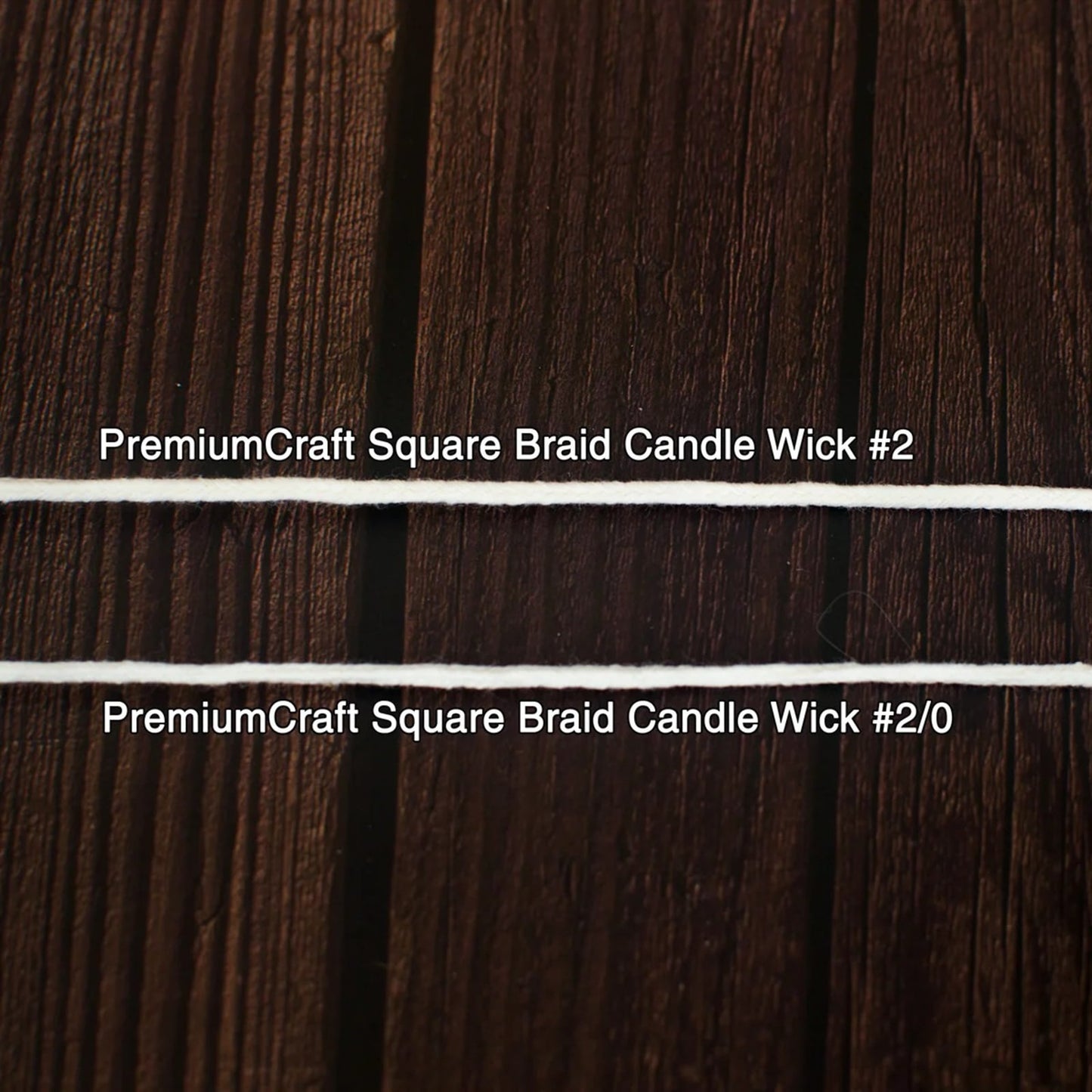 Close-up of two white square braided candle wicks laid horizontally on a dark wooden surface, suitable for use in candle making and included in lamps and lighting collections.