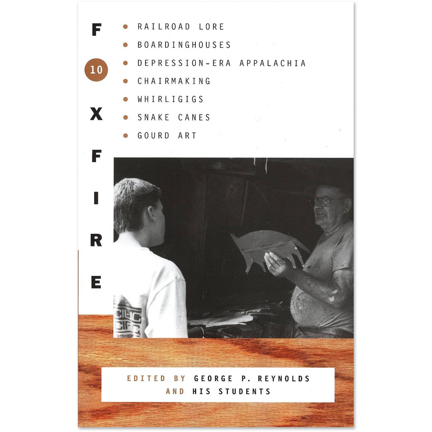 Cover of a heritage book featuring black-and-white photo of a craftsman demonstrating traditional woodworking to a young learner, highlighting Appalachian lore, chairmaking, and folk art, part of Best Sellers and Heritage and Lifestyle Books collections.