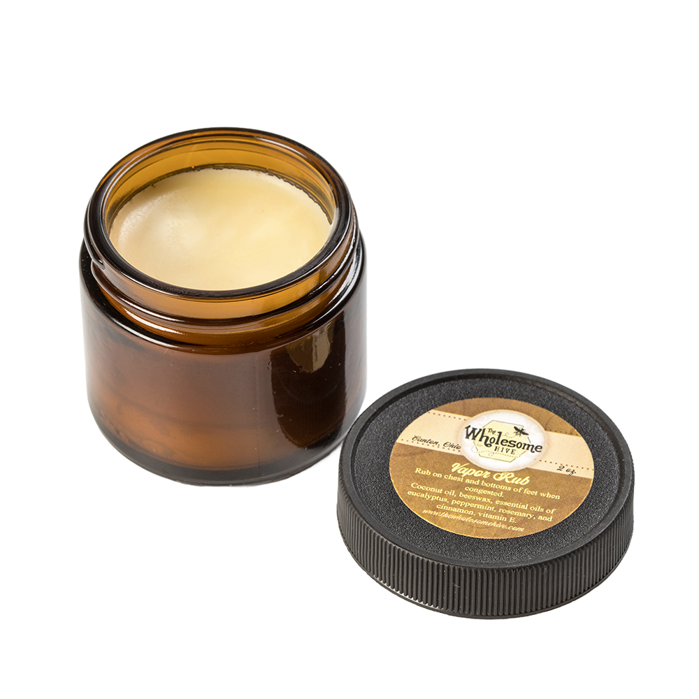 Amber glass jar of all-natural vapor rub with a smooth beeswax and coconut oil-based balm, featuring a round black lid with a beige label, ideal for Health & Wellness and USA Made collections.