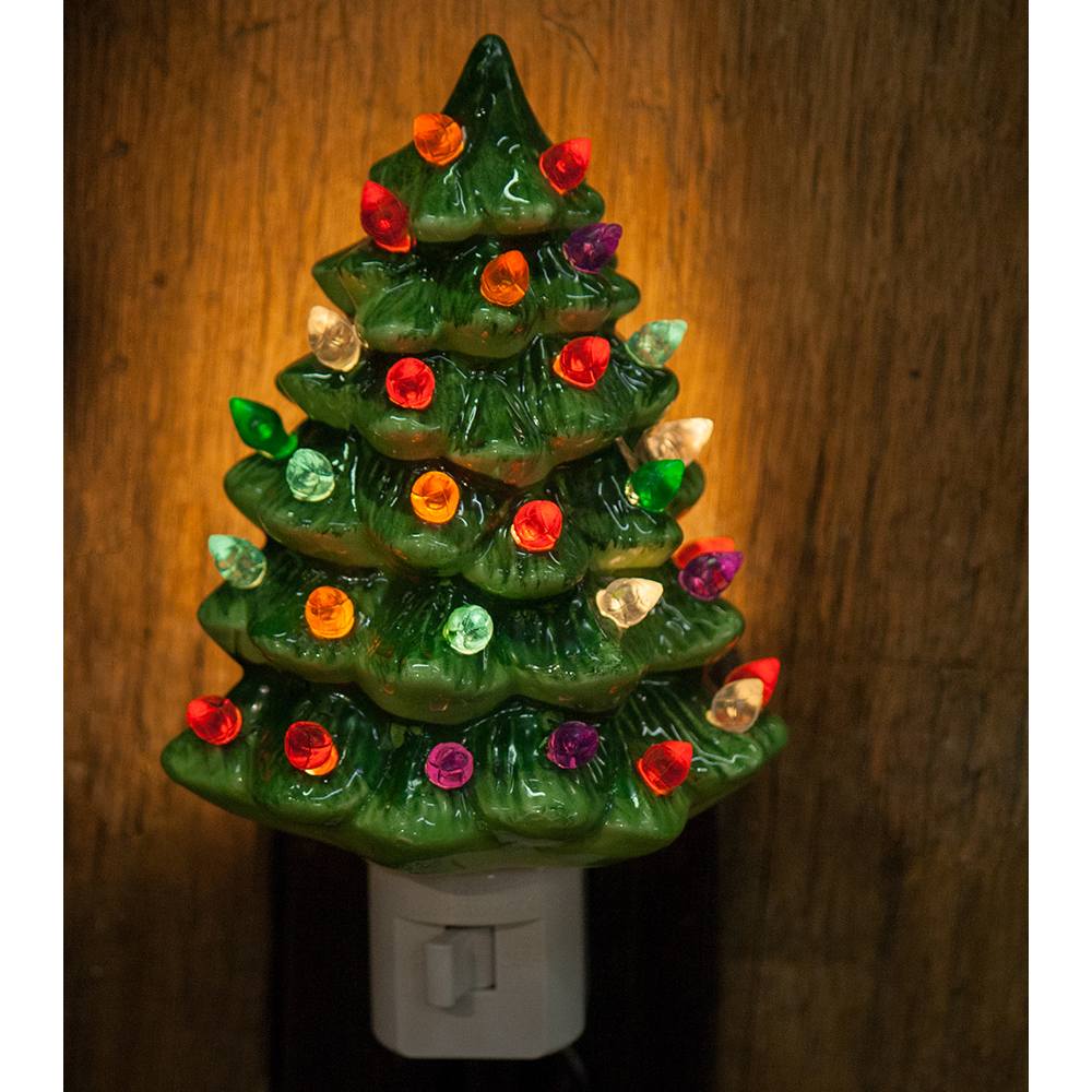 Handcrafted ceramic Christmas tree nightlight with multicolored bulbs glowing warmly, designed to add festive cheer to Home & Decor, Holiday Decor, and Best Sellers collections.