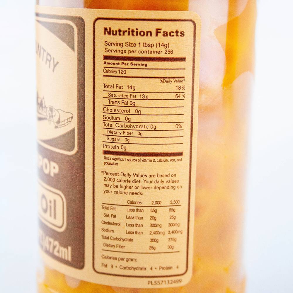 Close-up of nutrition facts label on a handcrafted, made in USA popcorn coconut oil container highlighting 120 calories per serving and zero carbohydrates, ideal for Kitchen & Food and Snacks collections.