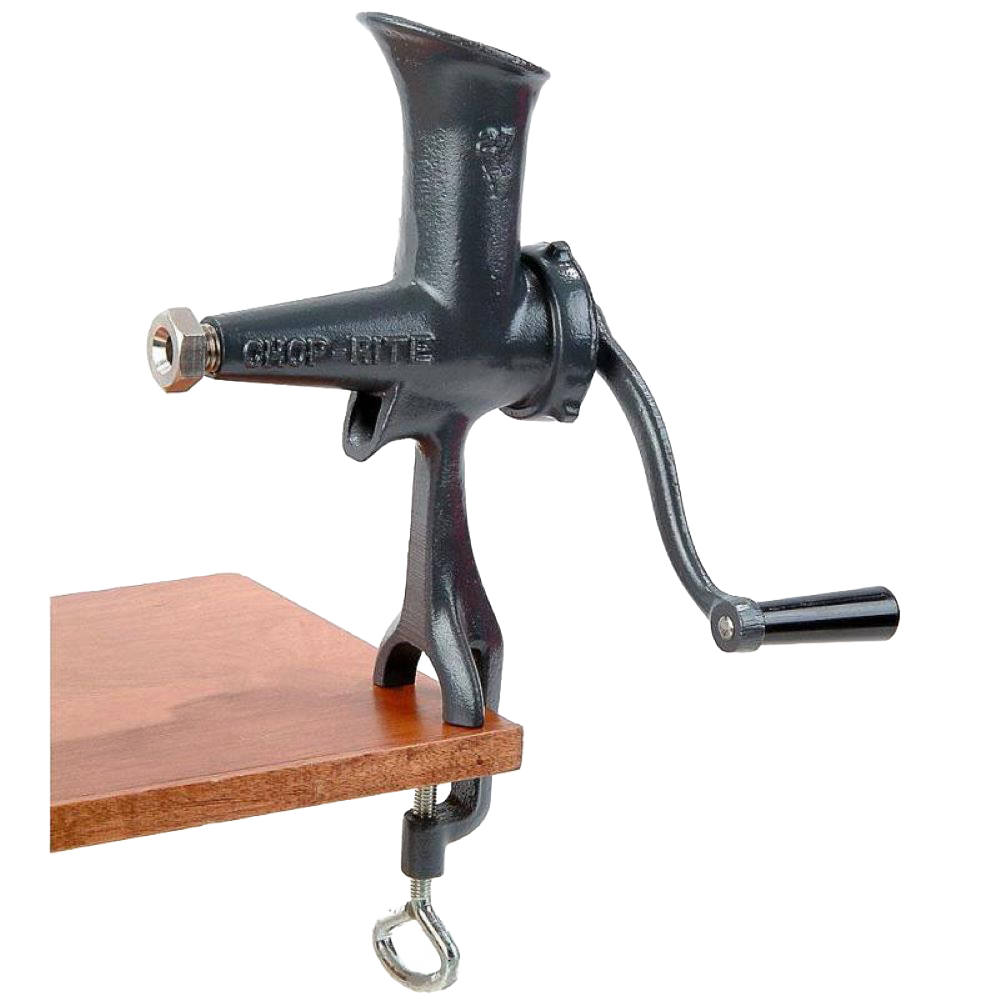 Compact cast iron wheatgrass juicer with black Xylon finish, hand-crank, and clamp base attached to a wooden surface, ideal for Kitchen & Food and USA Made collections.