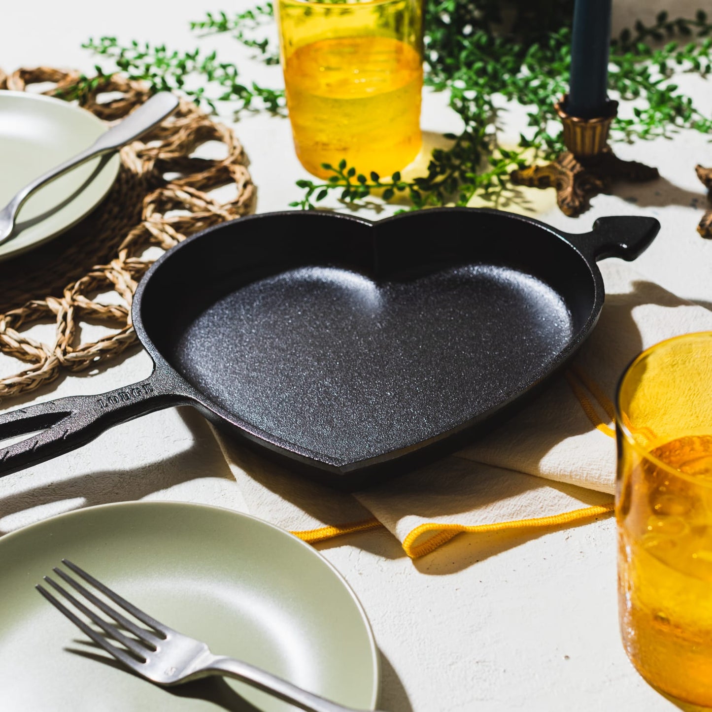 Handcrafted cast iron skillet in a heart shape with arrow detail, made in USA, perfect for unique baking and cooking, ideal for Kitchen & Food, Cookware, Cast Iron, Baking Supplies, Best Sellers, and Promo Eligible collections.