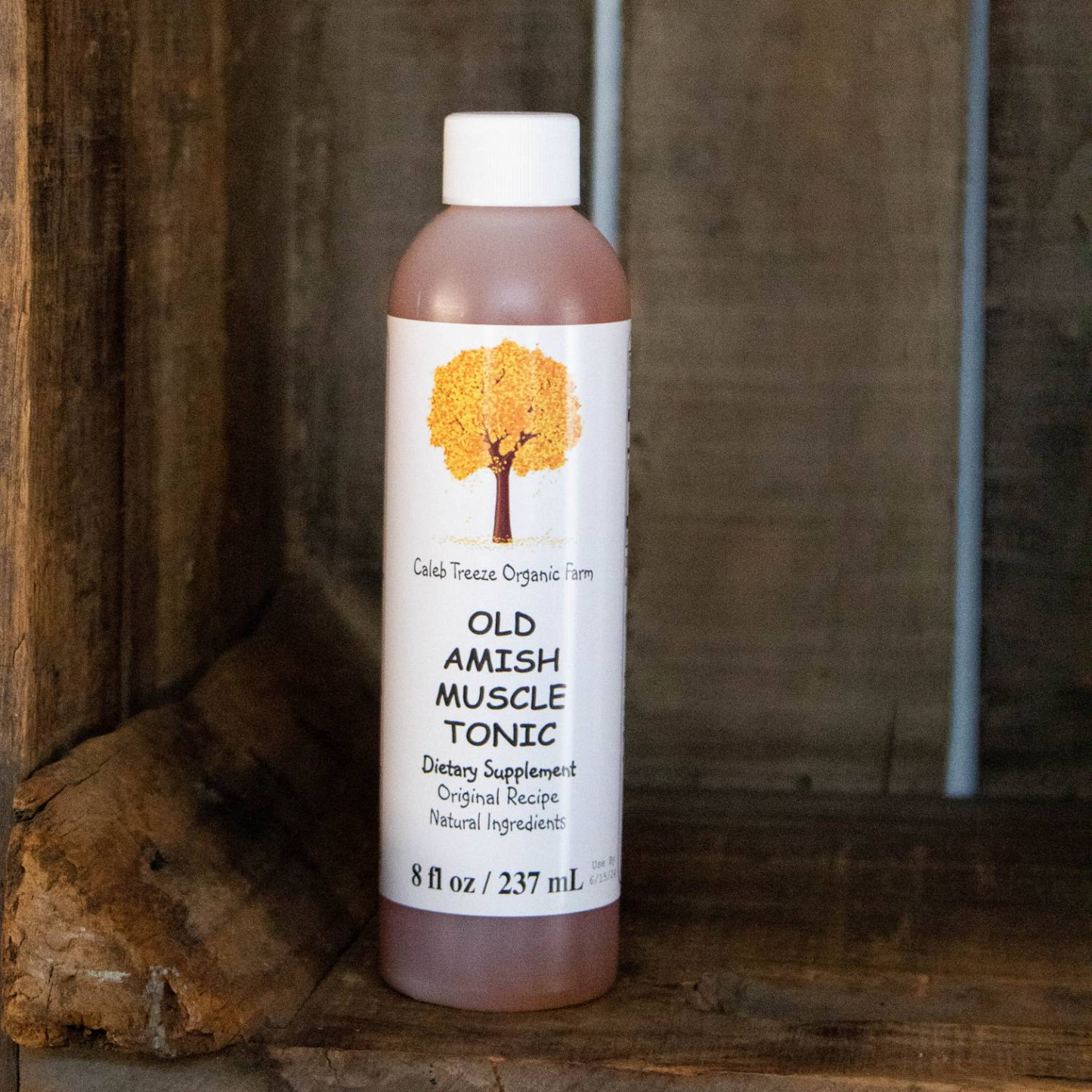 Bottle of Old Amish Muscle Tonic with organic farm label, natural remedy for leg and foot cramps, made in USA, featured in Health & Wellness and Best Sellers collections.