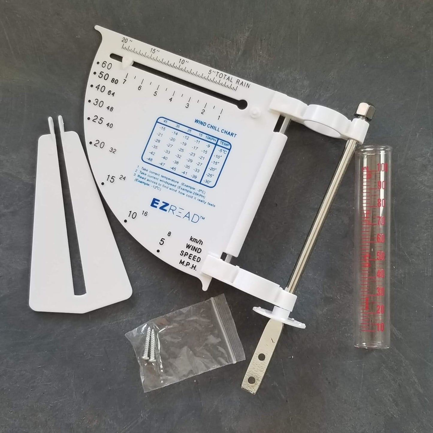 White 5-in-1 weather meter with wind chill chart, rain gauge, and temperature scale, including mounting hardware, designed for outdoor use in Farm, Garden & Tool and Garden Accessories collections.