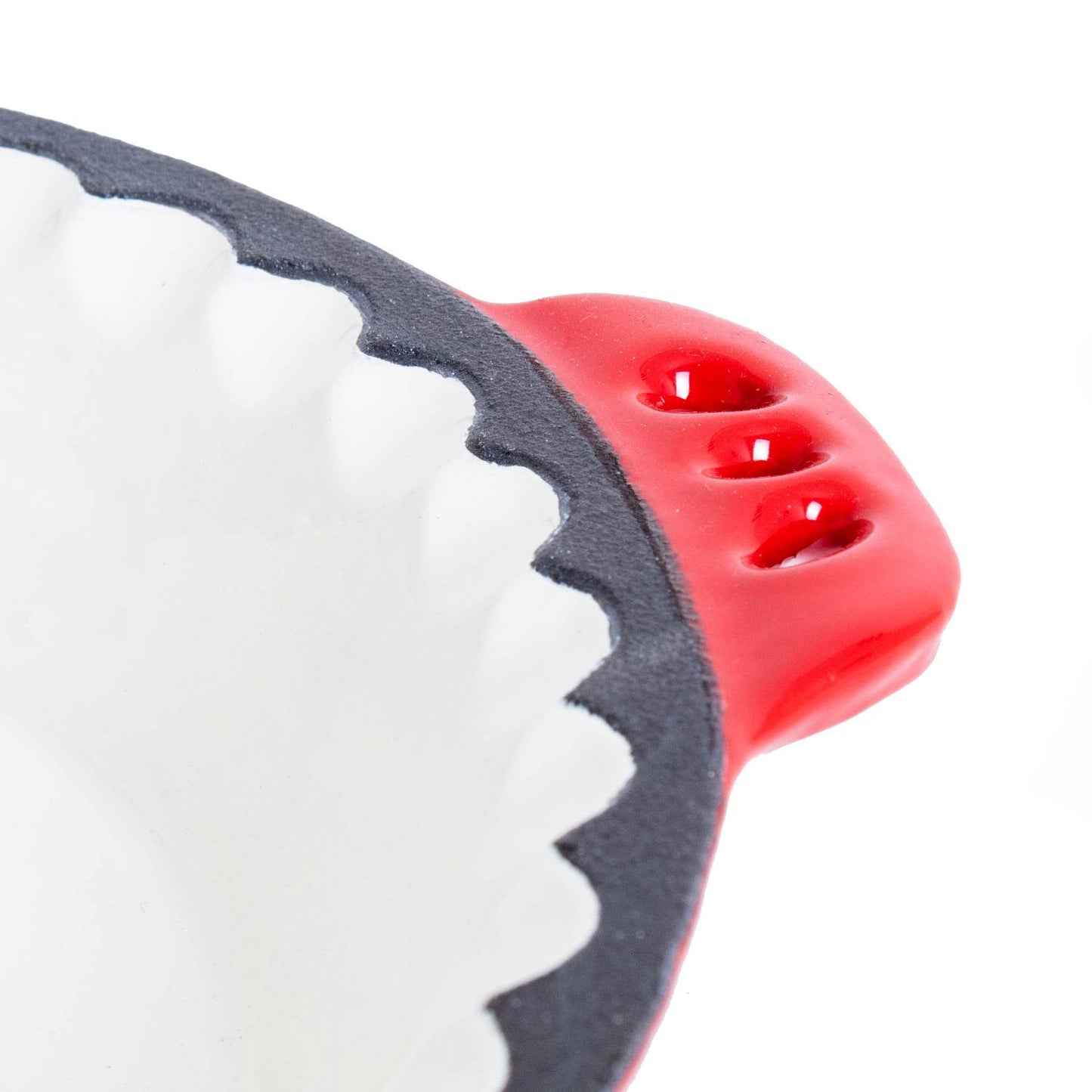 Close-up of a handcrafted cast iron pie pan with decorative crimped edges and a red handle, showcasing Amish-made durability for Kitchen & Food, Cookware, Cast Iron, Baking Supplies, Best Sellers, and Promo Eligible collections.