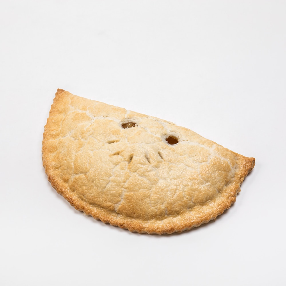 Golden half-moon shaped fruit turnover with a lightly browned flaky crust and decorative vent holes, a handcrafted treat featured in Kitchen & Food, Snacks and Sweets, USA Made collections.