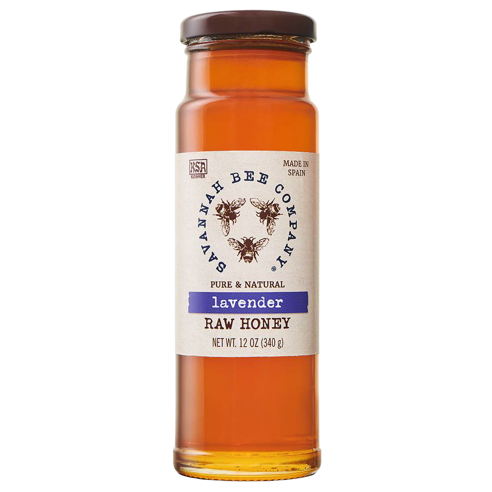 Tall clear glass jar of amber lavender raw honey with a simple white label featuring three bee illustrations and a brown lid, perfect for Kitchen & Food and Pantry collections in Best Sellers and Sale.