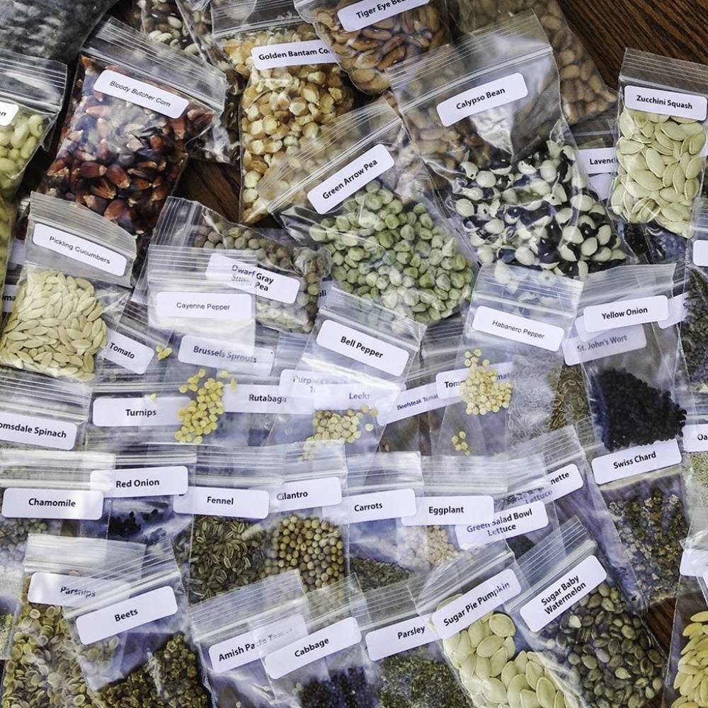Assortment of labeled seed packets including vegetables and herbs, arranged to showcase a diverse collection from Farm, Garden & Tool, Seeds and Planting, USA Made, and Best Sellers categories.