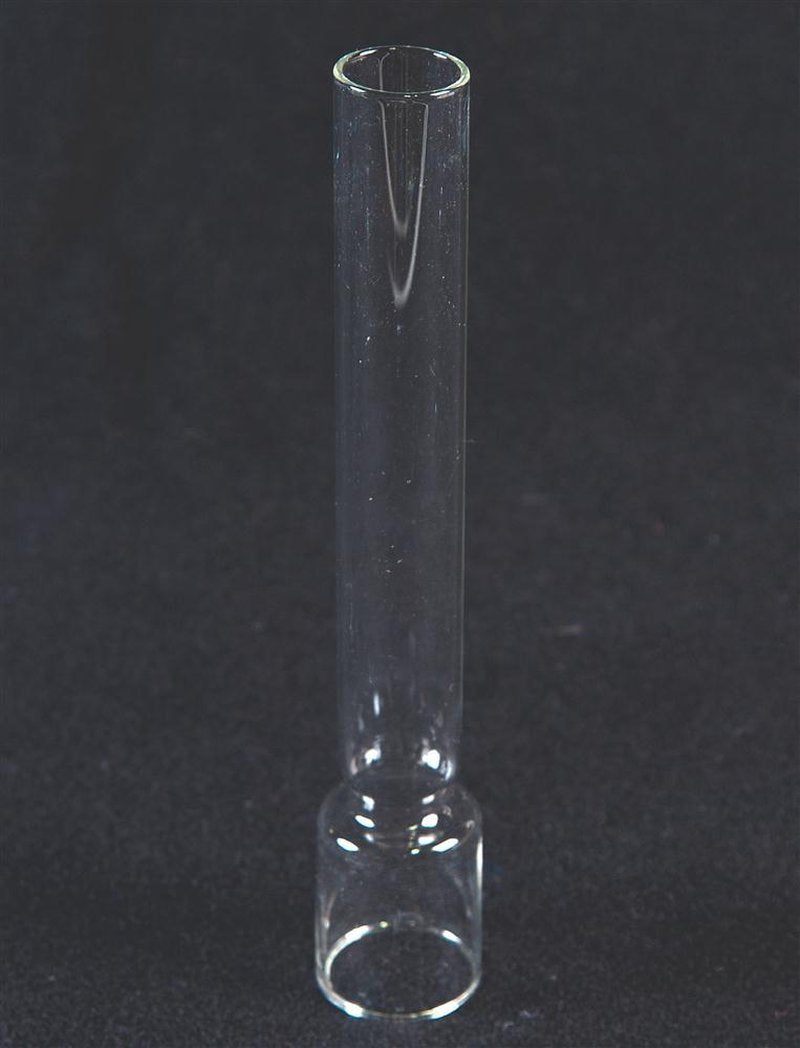 Clear glass chimney with cylindrical shape and rounded base, designed as a replacement part for oil lamps, featured in Lamps & Lighting and Chimneys and Globes collections.