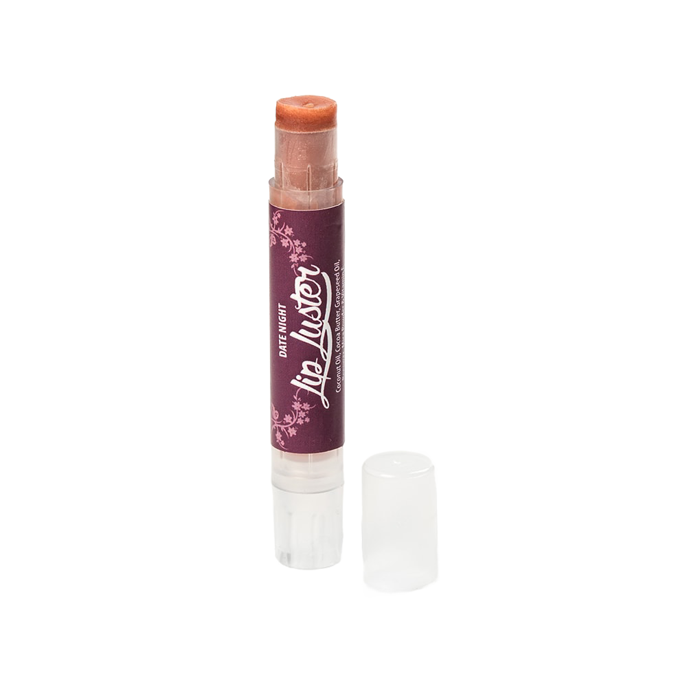 Handcrafted all-natural lip luster in a clear twist-up tube with a dark purple label, part of Health & Wellness and USA Made collections, offering creamy lip care and shine.