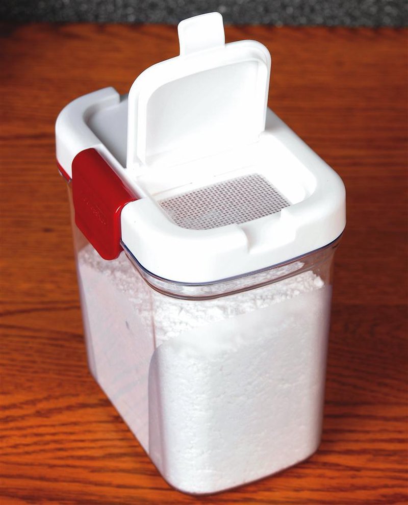 White storage container with red latch and dual lids, featuring a built-in sifter and leveler for powdered sugar, made from durable BPA-free plastic for Kitchen & Food and Storage and Serving collections.