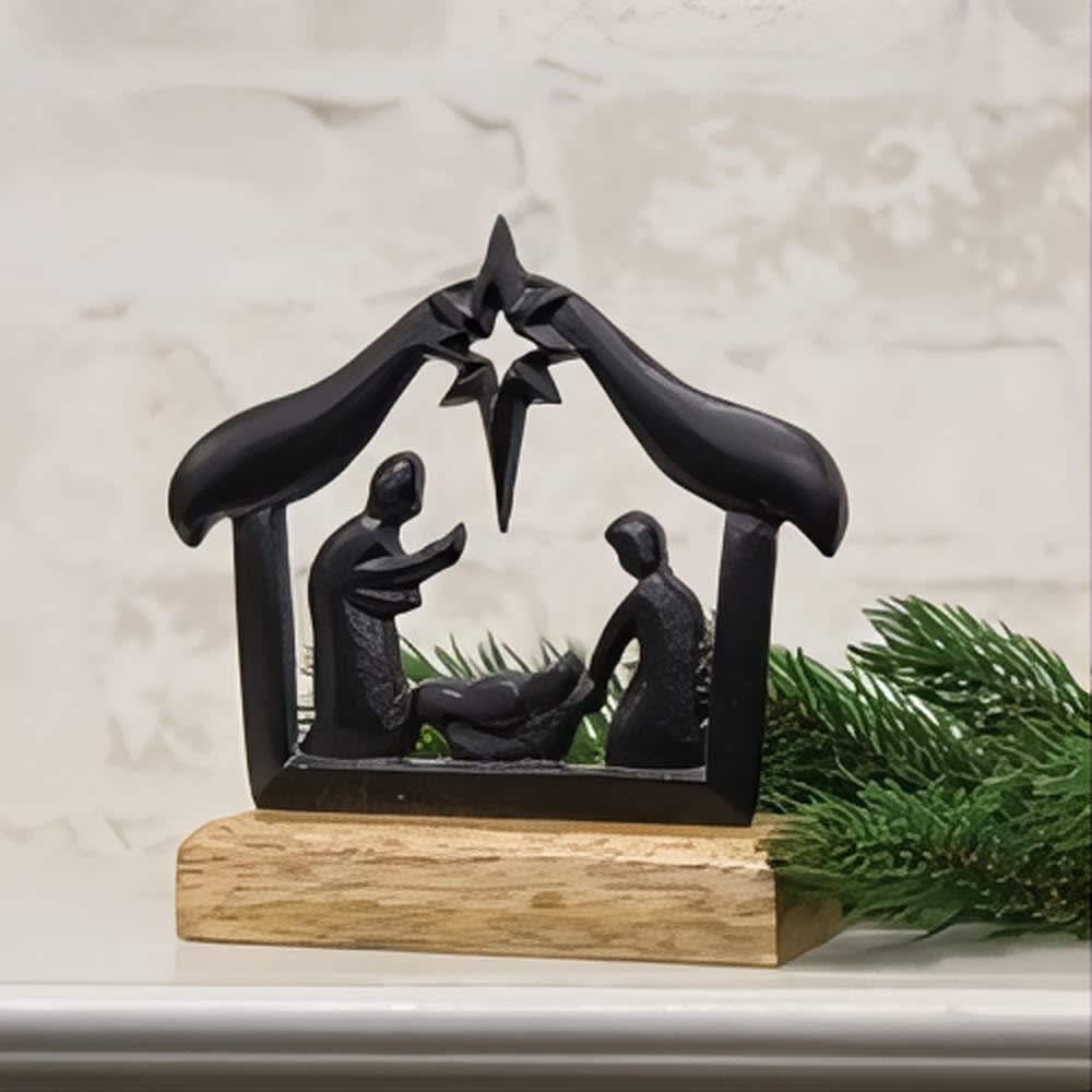 Handcrafted cast iron silhouette of the Holy Family under a North Star, mounted on a wooden base, perfect for Home & Decor, Holiday Decor, Best Sellers, and Promo Eligible collections.
