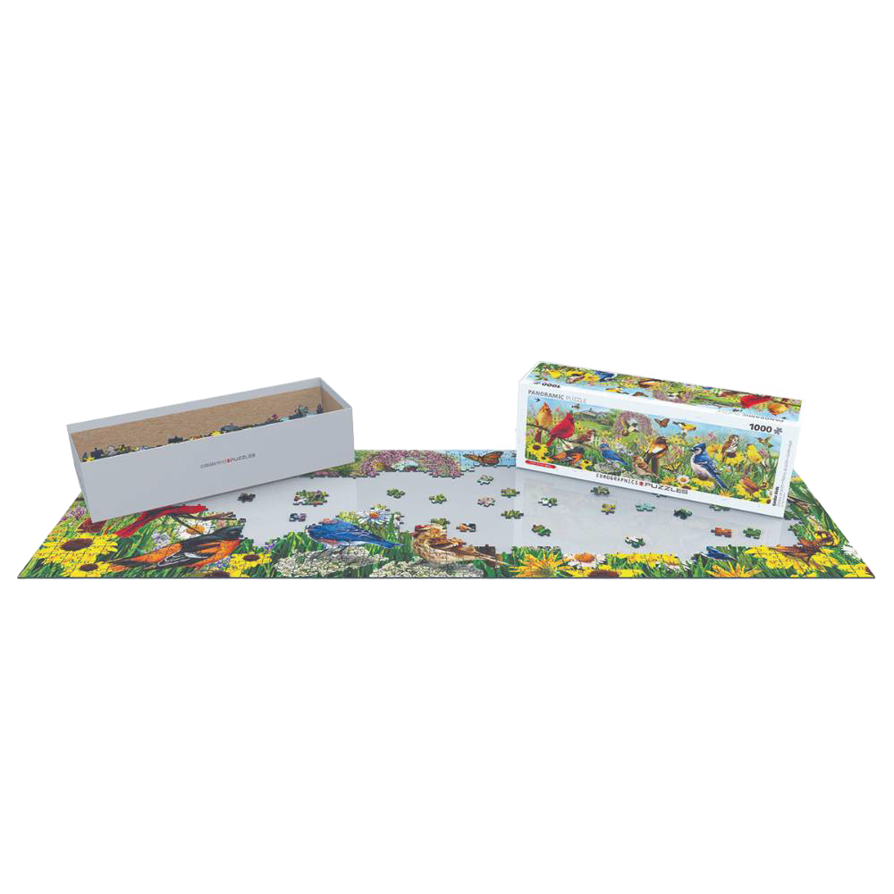 Partially completed 1000-piece puzzle featuring a colorful backyard bird scene with scattered pieces, accompanied by the puzzle box and a gray storage tray, part of Toys, Books & Games and USA Made collections.