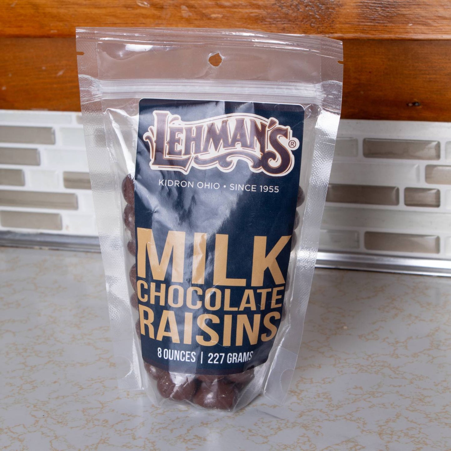Resealable clear pouch of handcrafted milk chocolate covered raisins by Lehman’s, made in USA, perfect for snacking from Kitchen & Food, Snacks and Sweets, Candy, USA Made, and Best Sellers collections.