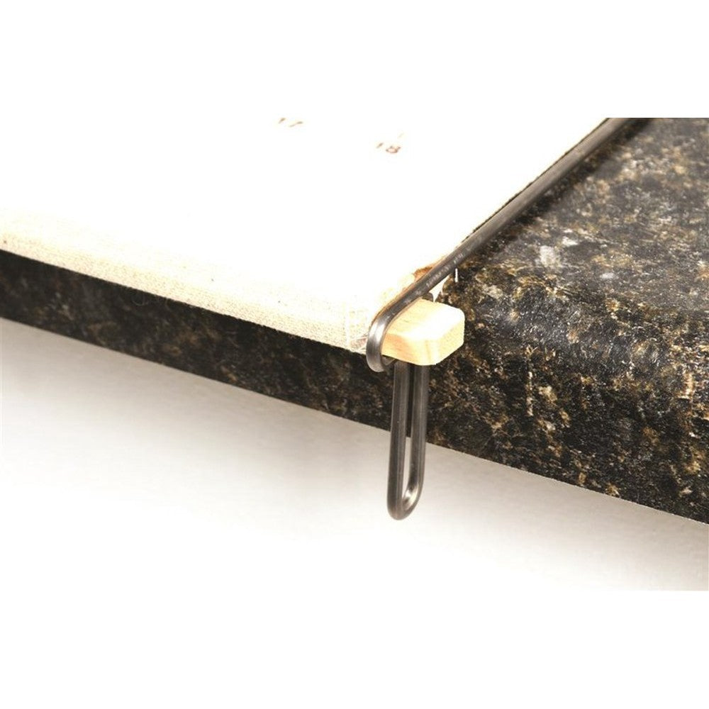 Close-up of wooden slat secured by a long metal loop resting on a dark granite countertop edge, showcasing the pastry frame’s design to stay taut and stable during use, ideal for Kitchen & Food, Cookware, Baking Supplies, Best Sellers, and Promo Eligible collections.