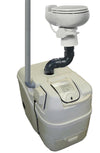 Compact composting toilet system with white seat and beige base featuring vent pipe and plumbing, designed for narrow spaces and seasonal use in appliances and composting toilets collections.